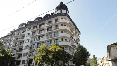 a large white building with a tower on top at Apartment SOFIA Center in Sofia