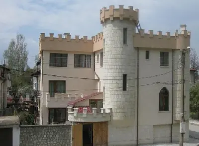 a building with a tower on top of it at The Castle Hotel in Samokov