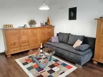 a living room with a couch and a table at Apartments Sofia Yavorov in Sofia