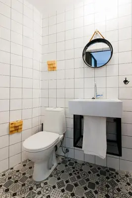 a bathroom with a toilet and a sink at Mouse House Kapana in Plovdiv
