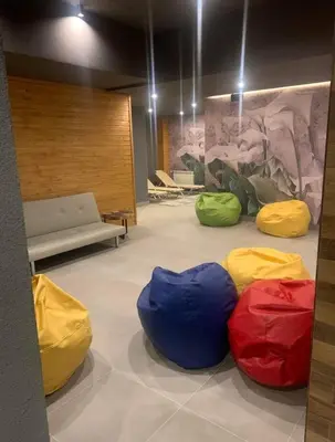a room with four colorful bean bags on the floor at Apartment in Borovets Gardens C17 in Borovets