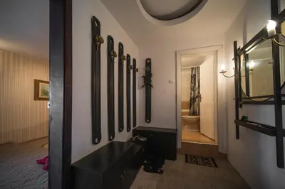 a hallway with a row of mirrors on a wall at Sunny Apartment Sofia in Sofia