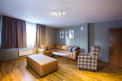 a living room with a couch and a table at Sunny Hills Ski&Wellness in Pamporovo