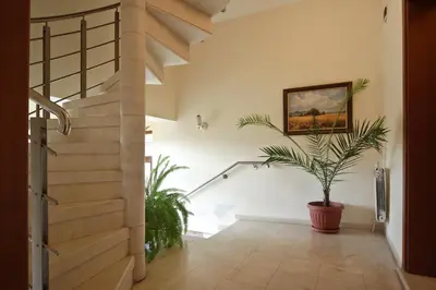 a staircase in a house with a potted plant at Anita House in Perushtitsa
