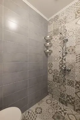 a bathroom with a shower with a toilet in it at Downtown Wanderlust Apartment in Sofia