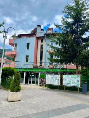 a large building with a sign in front of it at Hotel Elit in Devin