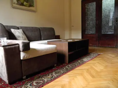 a living room with a couch and a table at Top Place in Downtown in Sofia