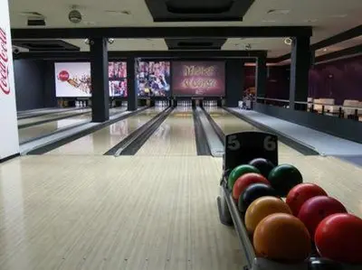 a bowling alley with balls on the lanes at Top Place in Downtown in Sofia