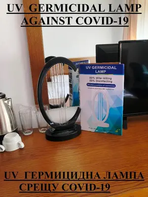 a black fan sitting on a desk next to a box at Bellevue Residence Apartments in Bansko