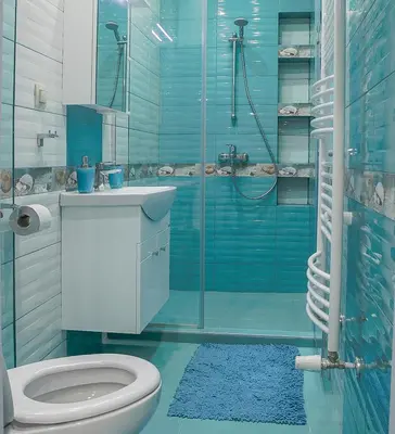 a blue bathroom with a toilet and a shower at City center Apartment in Sofia