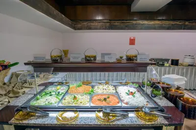 a buffet line with many different types of food at Hotel Prespa in Pamporovo