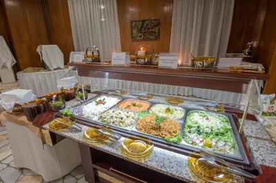 a buffet line with many different types of food at Hotel Prespa in Pamporovo