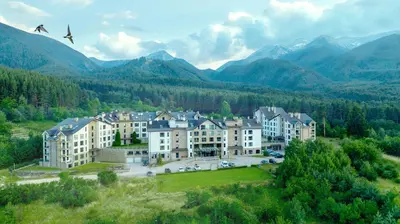 an aerial view of a large building in the mountains at Saint George Palace Aparthotel in Bansko