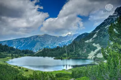 a mountain lake in the middle of a valley at Mamin Kolio in Bansko
