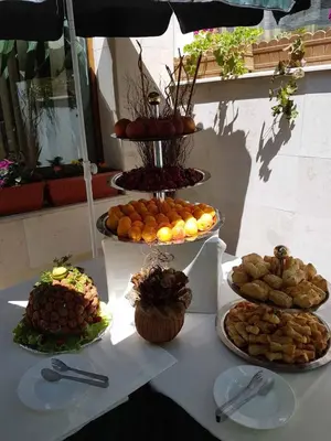 a table with several different types of food on it at Meteor Family Hotel in Chepelare