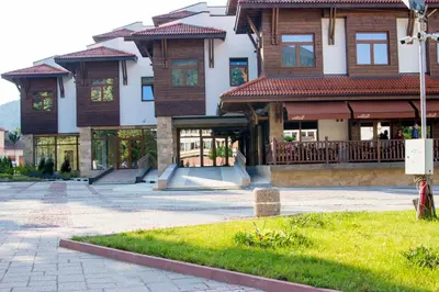 a building with a skate park in front of it at Hotel Etropolia in Etropole
