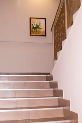 a staircase in a building with a picture on the wall at Hotel Etropolia in Etropole