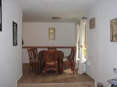 a dining room with a table and chairs at Elitza Villa in Pamporovo