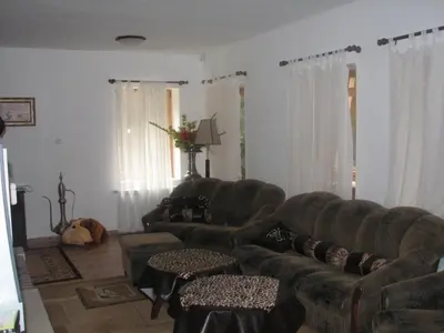 a living room with two couches and a couch at Elitza Villa in Pamporovo