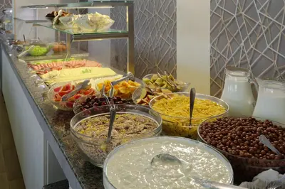 a buffet with many different types of food on a counter at Augusta SPA Hotel in Hisarya