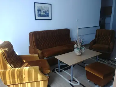 a living room with two couches and a coffee table at Apartment 