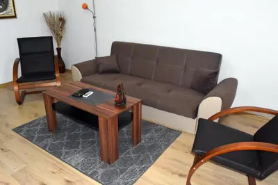 a living room with a couch and a coffee table at Къща Стария град in Plovdiv