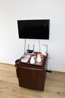 a flat screen tv sitting on top of a table at Къща Стария град in Plovdiv