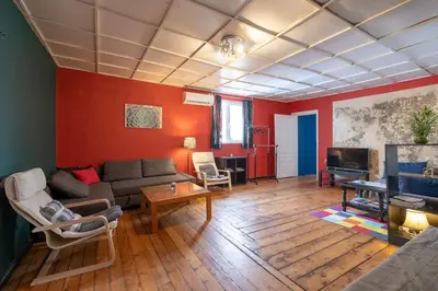 a living room with a couch and a table at Cool Central Apartment in Sofia