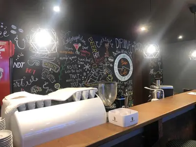 a restaurant with a wall covered in graffiti at Borovets Gardens Apartments in Borovets