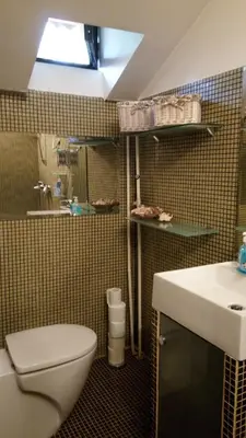 a bathroom with a toilet and a sink at Mini Apartment Best Rest in Plovdiv