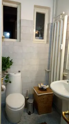 a bathroom with a toilet and a sink at Maritza Apartment in Plovdiv