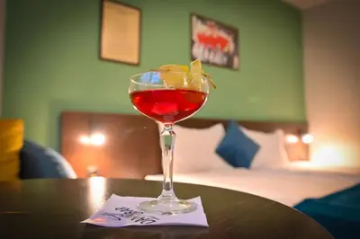a drink in a glass sitting on a table at Hotel Ida in Bansko