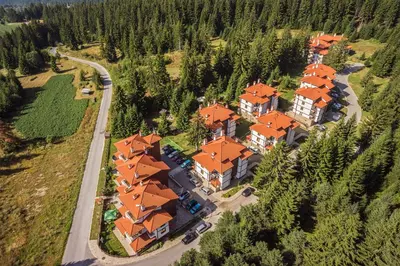 an aerial view of a large house with orange roofs at Mountain Lake Hotel in Smolyan