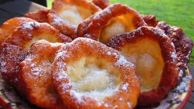 a plate of food with sugar covered onion rings at Vakarel Residence in Vakarel