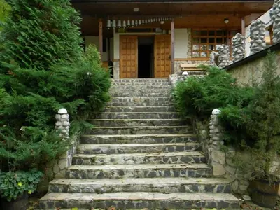 a set of stone stairs in front of a house at Balkanski chanove in Botevgrad