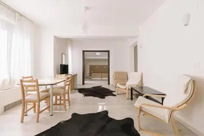 a living room with a table and chairs at Eco Hotel Zdravetz in Tsar Kaloyan