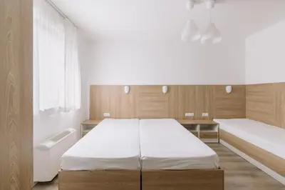 a bedroom with a large bed and a window at Eco Hotel Zdravetz in Tsar Kaloyan