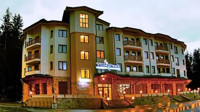 a large building with a sign in front of it at Enjoy Studios and Lovely Apartment Villa Park in Borovets