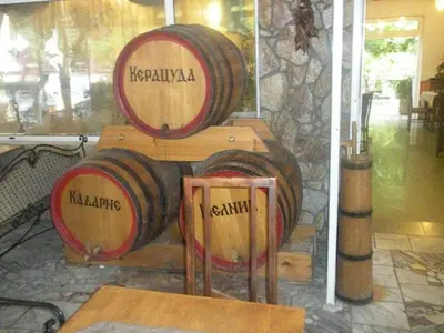 two wooden barrels sitting on top of a table at Hotel- Restaurant Struma in Stara Kresna