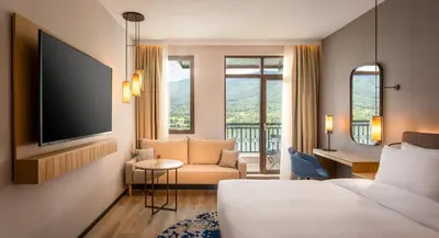 a hotel room with a bed and a tv at Hyatt Regency Pravets Resort in Pravets