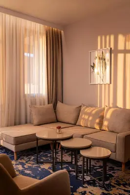 a living room with a couch and tables at Hyatt Regency Pravets Resort in Pravets