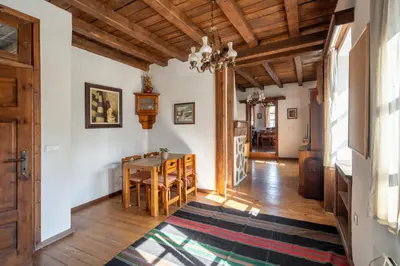 a kitchen and dining room with a table and chairs at Chalet White Fang in Bansko