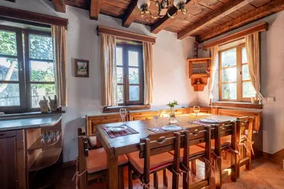 a dining room with a wooden table and chairs at Chalet White Fang in Bansko