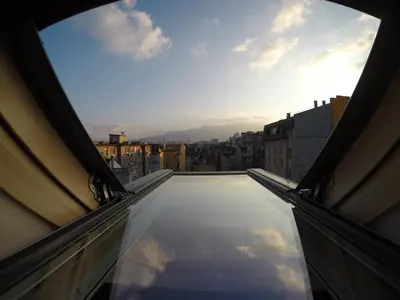 a view from the balcony of a building with the sky at Gramophone Sofia Downtown Apartment in Sofia