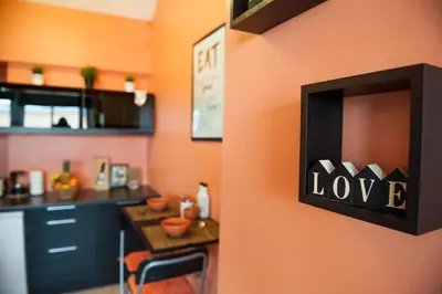 a kitchen with a counter with a sign that says love at Studio 5 Corners in Sofia