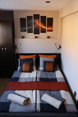 a bedroom with a bed with pumpkins on it at Studio 5 Corners in Sofia