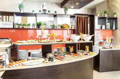 a buffet line with a lot of food on it at City Avenue Hotel in Sofia