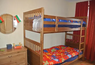 a bedroom with two bunk beds and a mirror at Feels like Home 