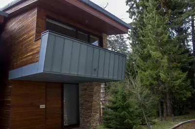 a balcony on the side of a house at Borovets Chalets in Borovets