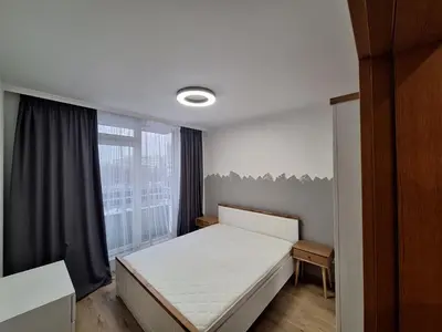 a bedroom with a white bed and a window at Apartments Mladost 1A in Sofia